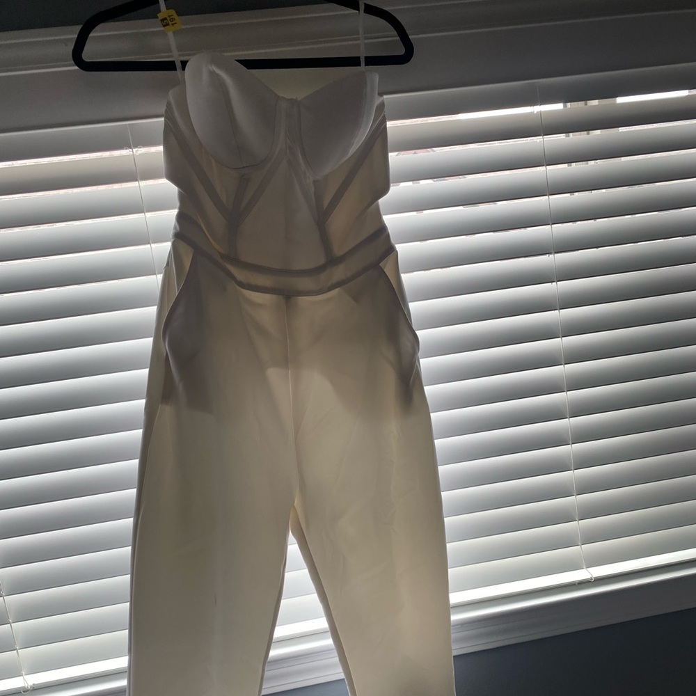 White, bebe strapless jumpsuit size small